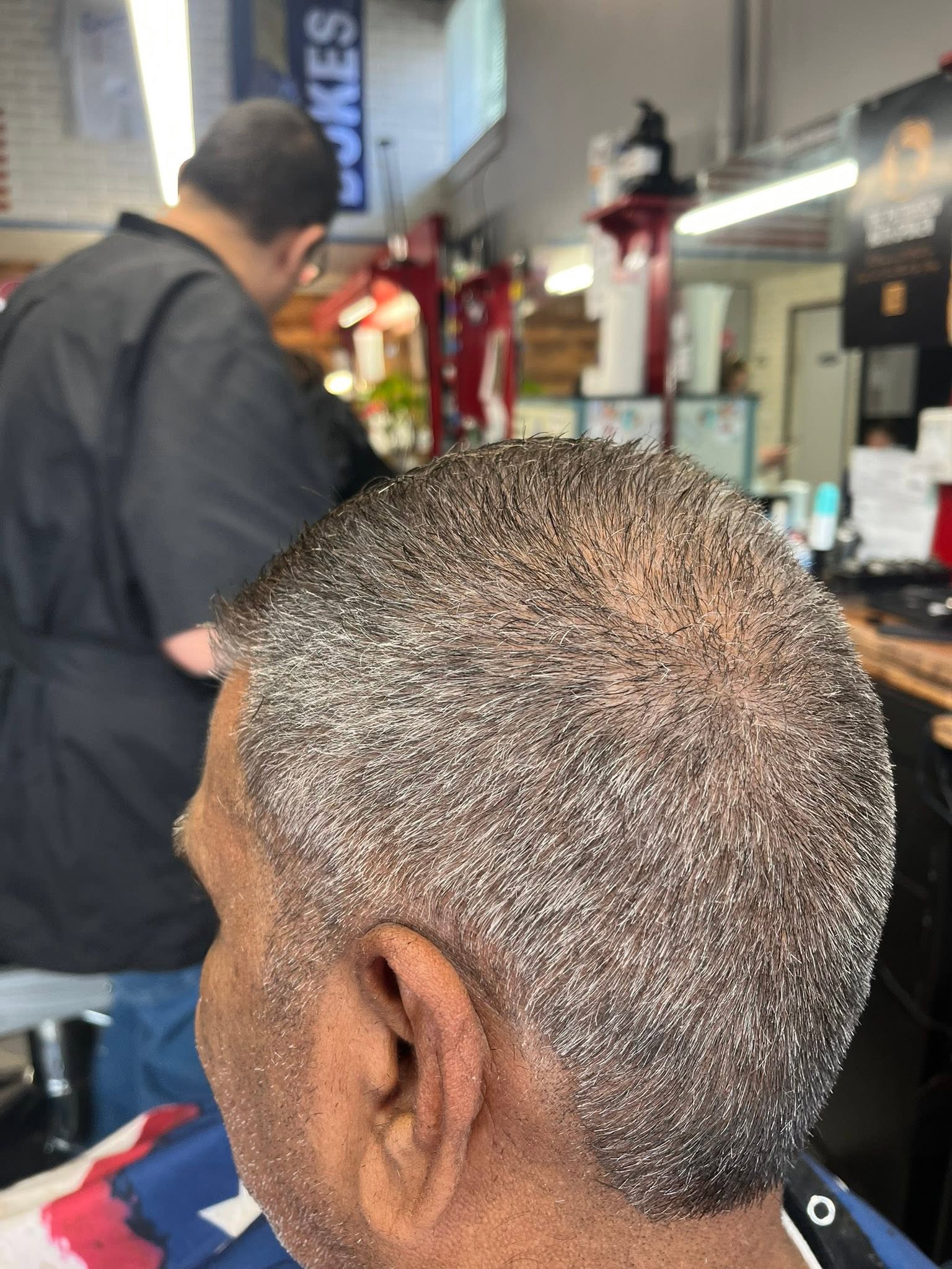 Textured fade haircut by Downtown Barber Shop